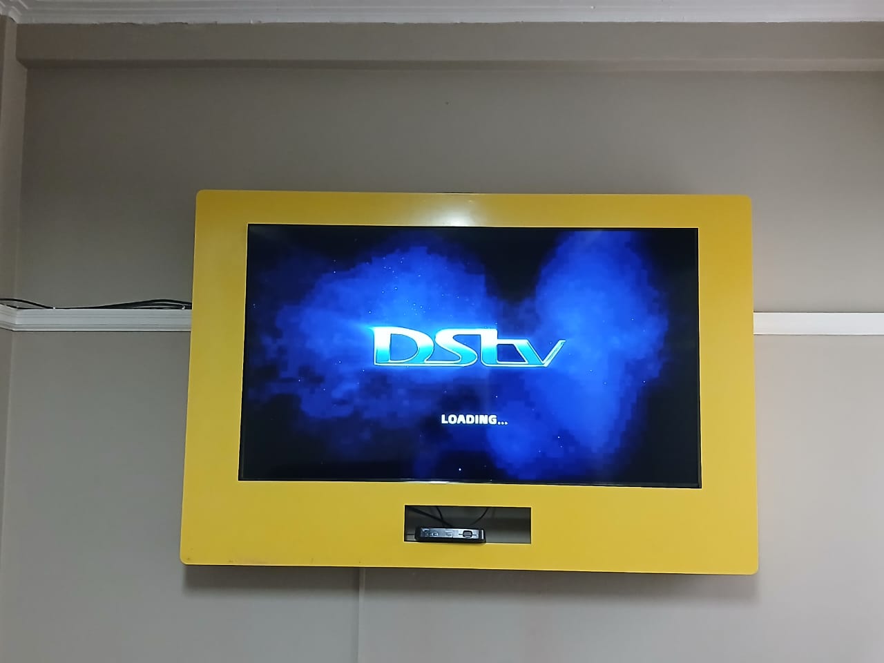 Wall-mounted TV with DStv Explora setup in uMhlanga home